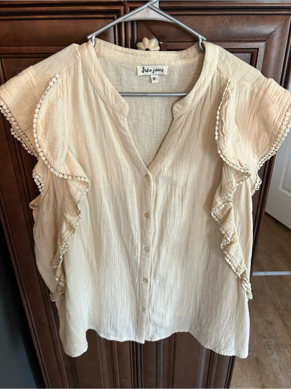 Suko Cream Ruffle Button-Front Blouse in 100% cotton.